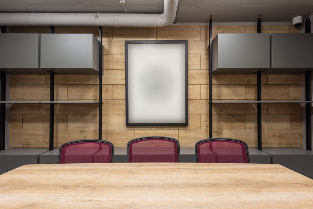 Empty chair at a long boardroom table. Cover image for Marketing Kept One of the Four Ps: A CMO on Why the Role Is Disappearing.