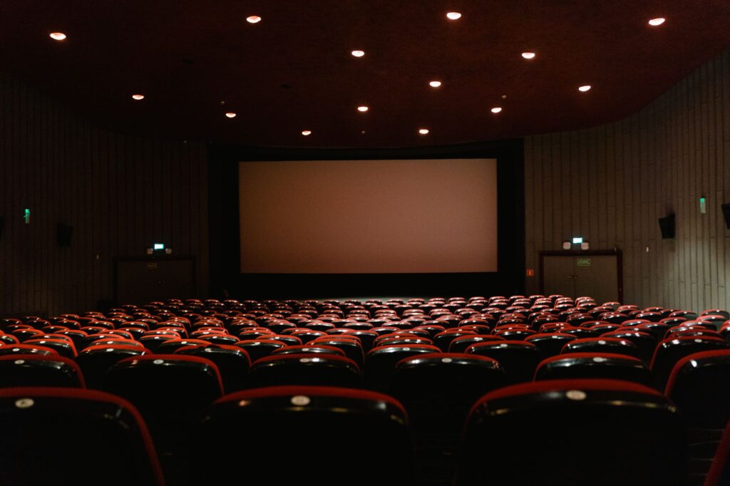 Film projector running in a dark screening room. Cover image for The Film Nobody Was Supposed to See: How Dove's Positioning Got Through the Room.