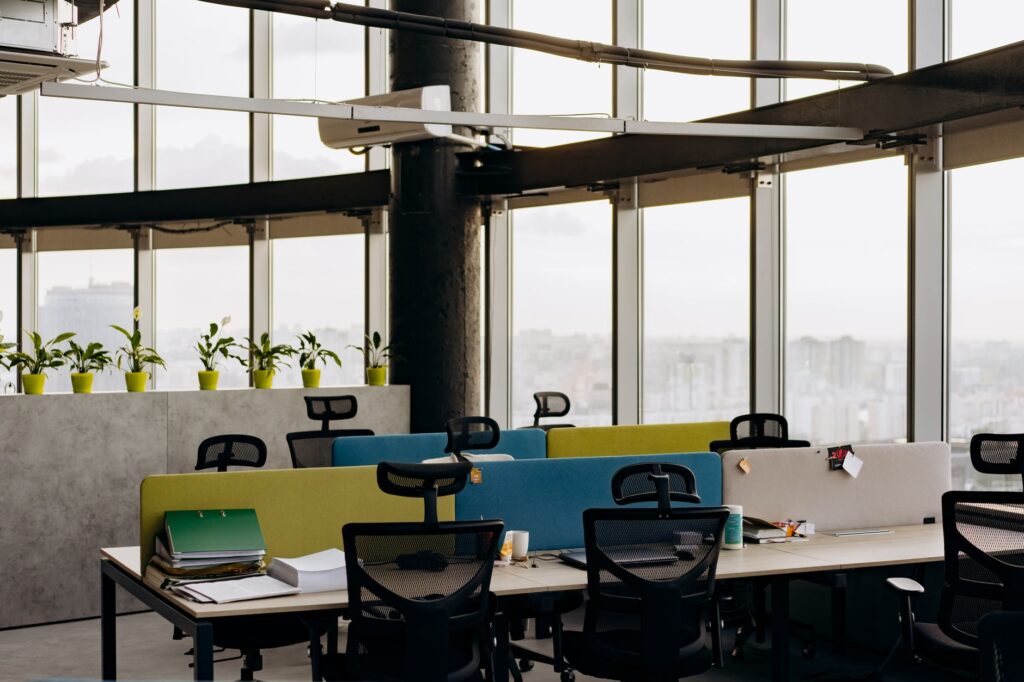 Empty desk in a bright modern office. Cover image for Fire Yourself Every Eighteen Months: A Chief Brand Officer on Not Owning the Past.