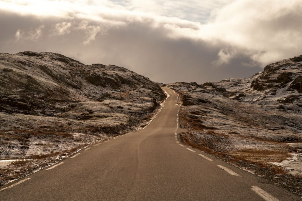 Open road winding through mountains. Cover image for Operational Progress Creates Strategic Degrees of Freedom.