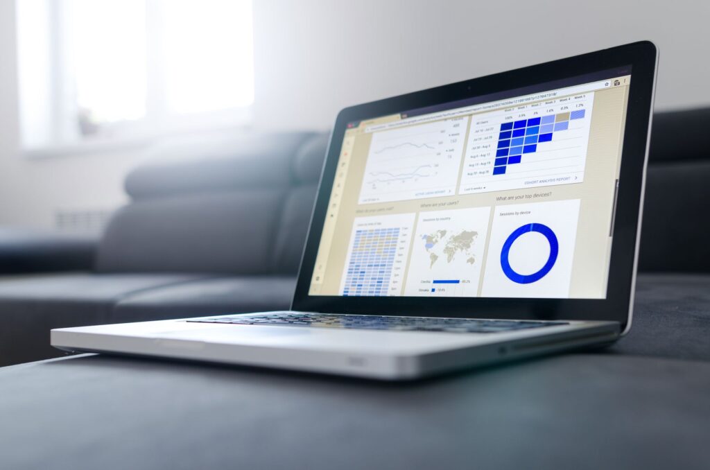 Analytics dashboard on a large monitor. Cover image for The Hungry Monster: Investing in Data Two Years Before It Pays.
